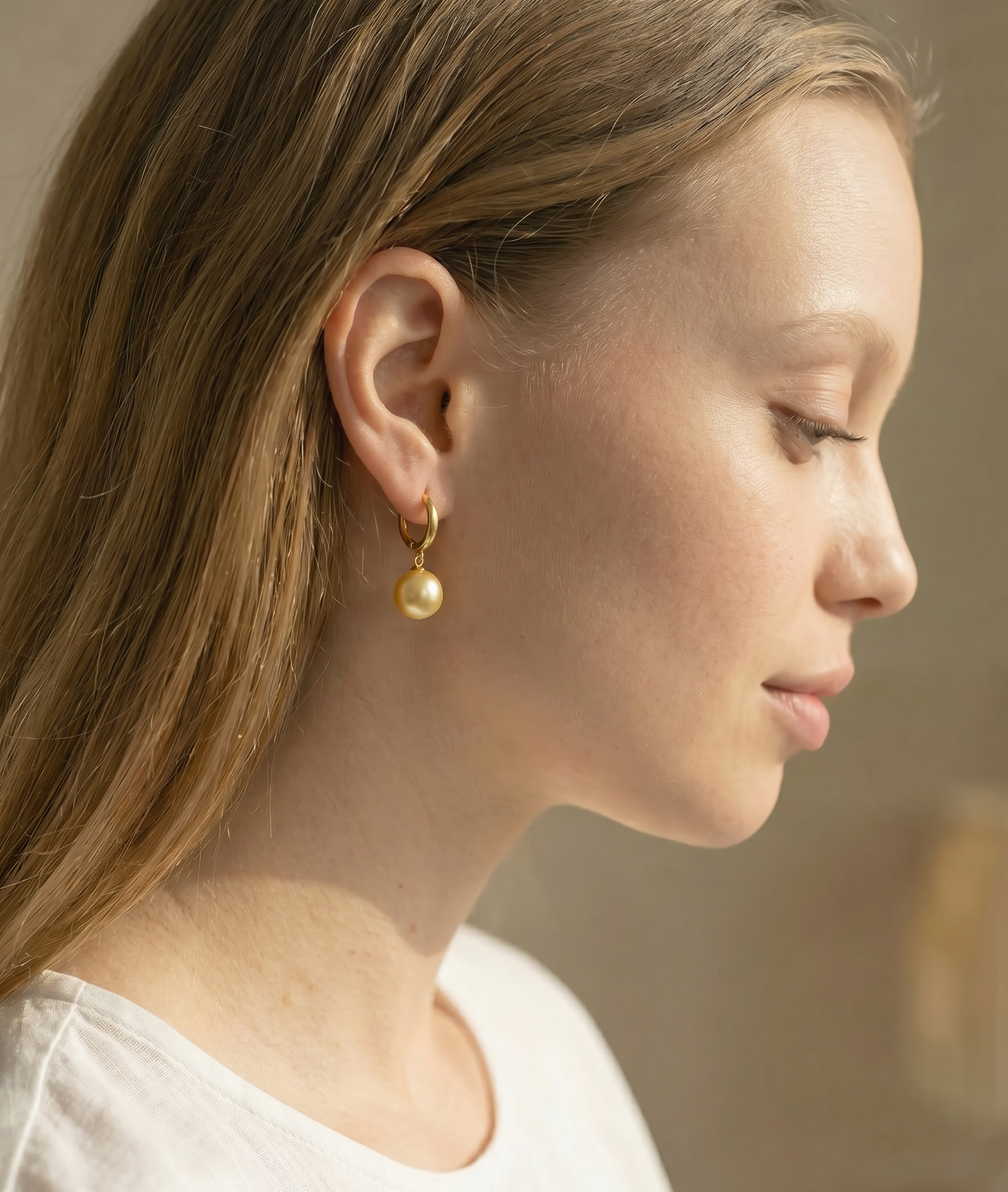 Golden South Sea Pearl Huggie Tania Earrings - Model Image